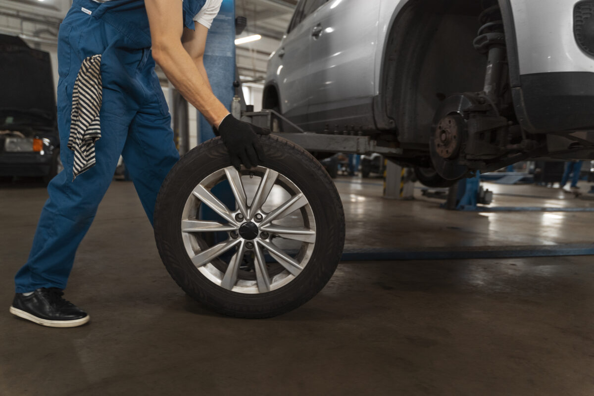 mechanic-working-shop-car
